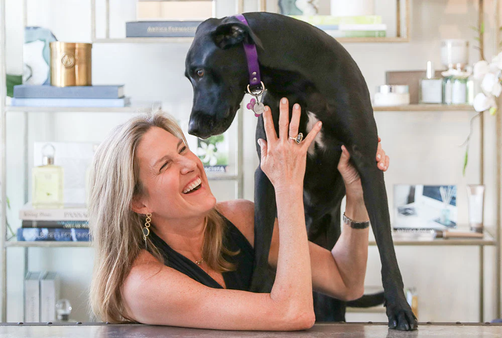 woman holding dog