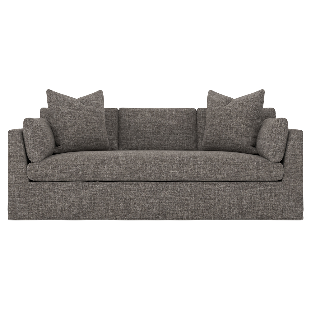 brown slipcovered sofa with bench seat