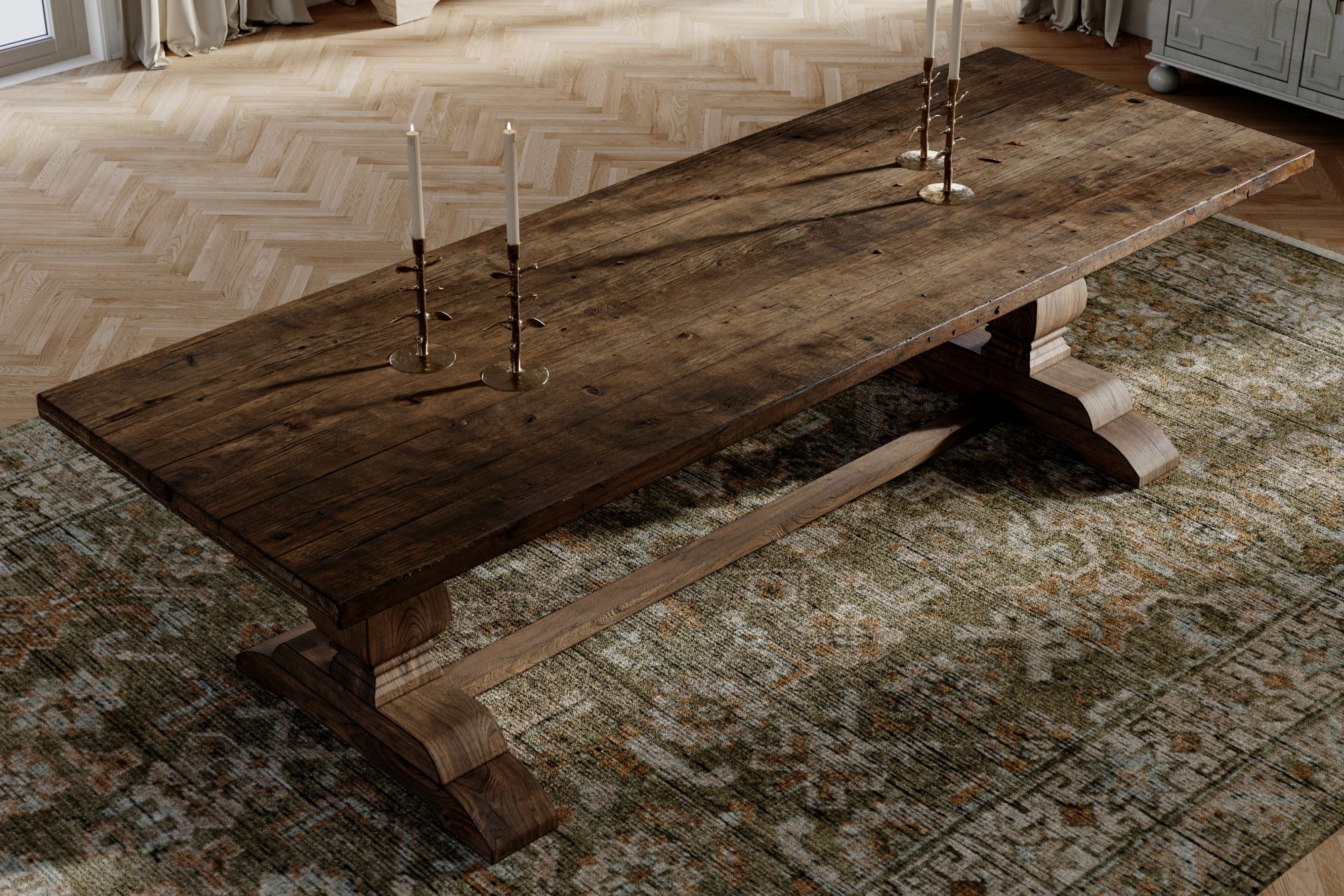 Arbois French Country Oak Wood Trestle Dining Table on top of a green patterned hand-knotted rug