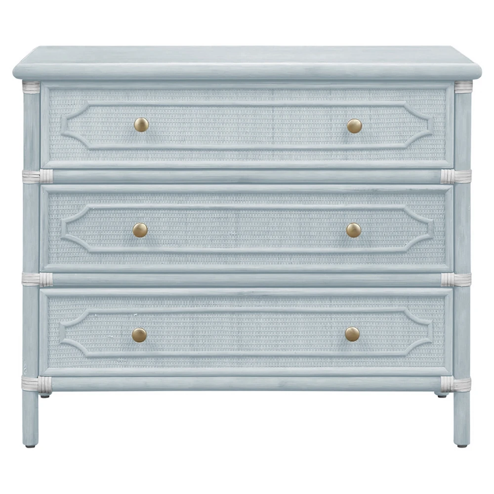blue woven rattan chest with three drawers and gold knobs