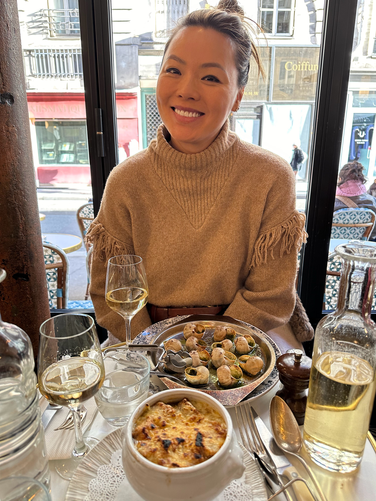 woman eating escargot