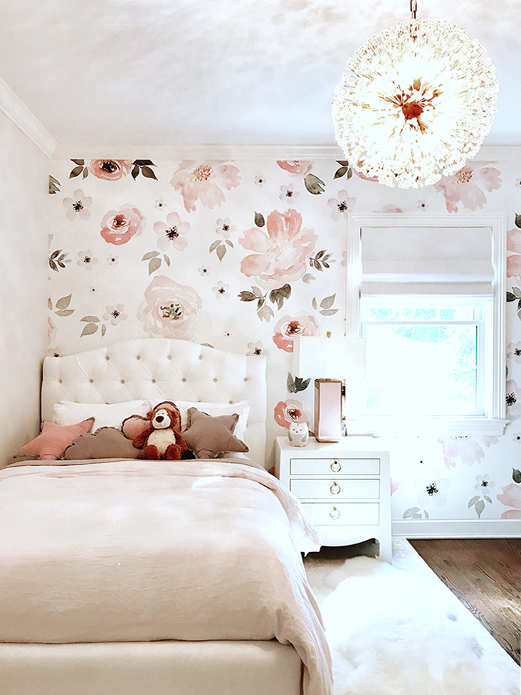pink kids room with floral wallpaper