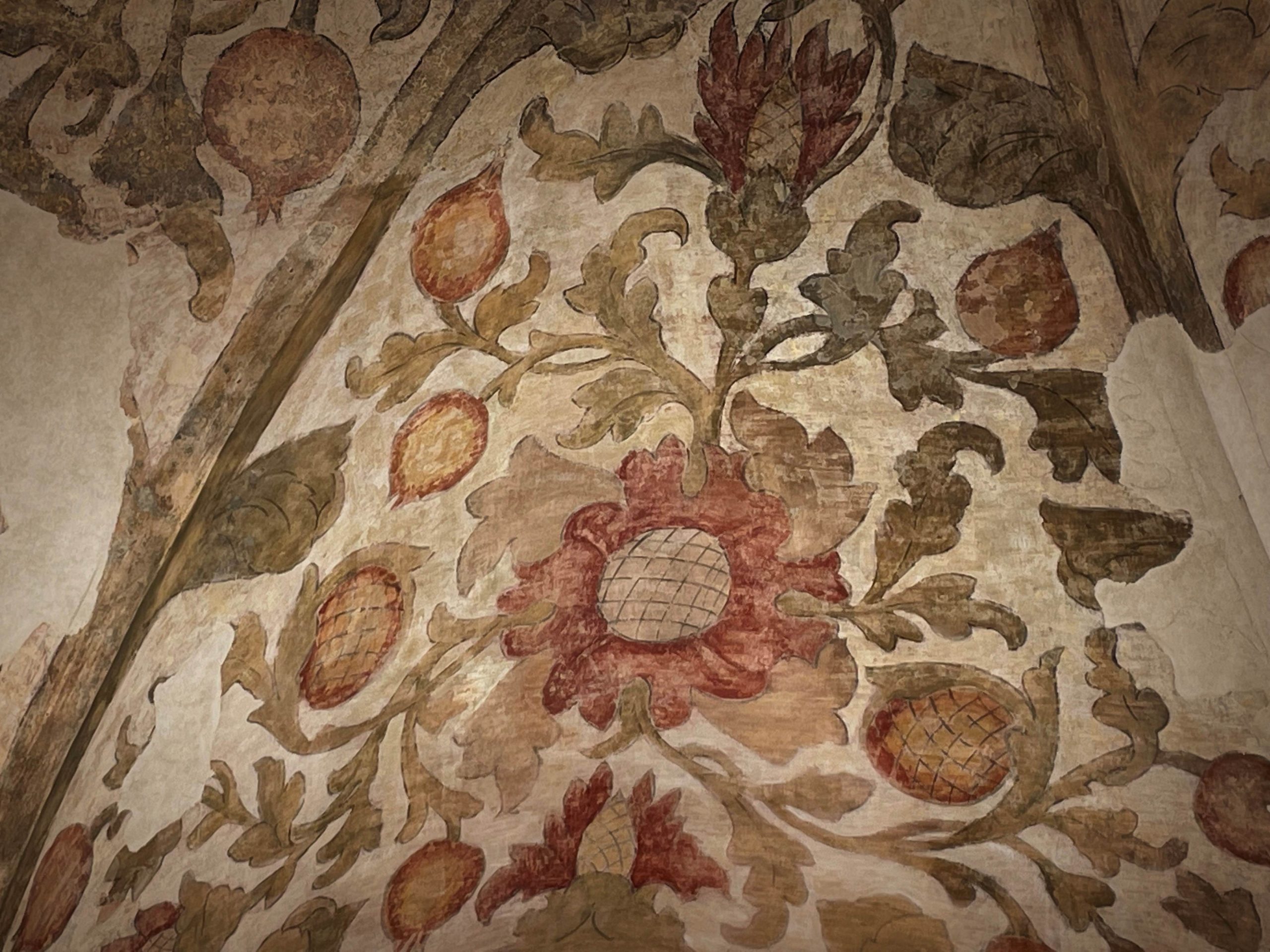 Italian Fresco with a floral design in red, sage green, cream, and orange