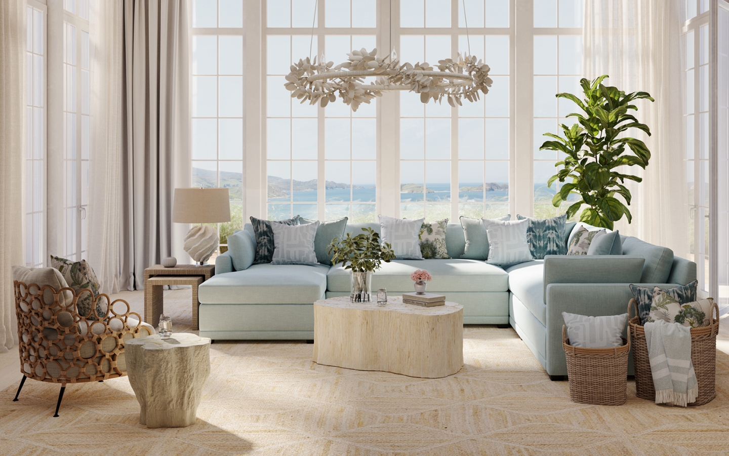 A chaise sectional with blue performance fabric is topped with throw pillows in an elegant coastal living room with a blue and green color palette