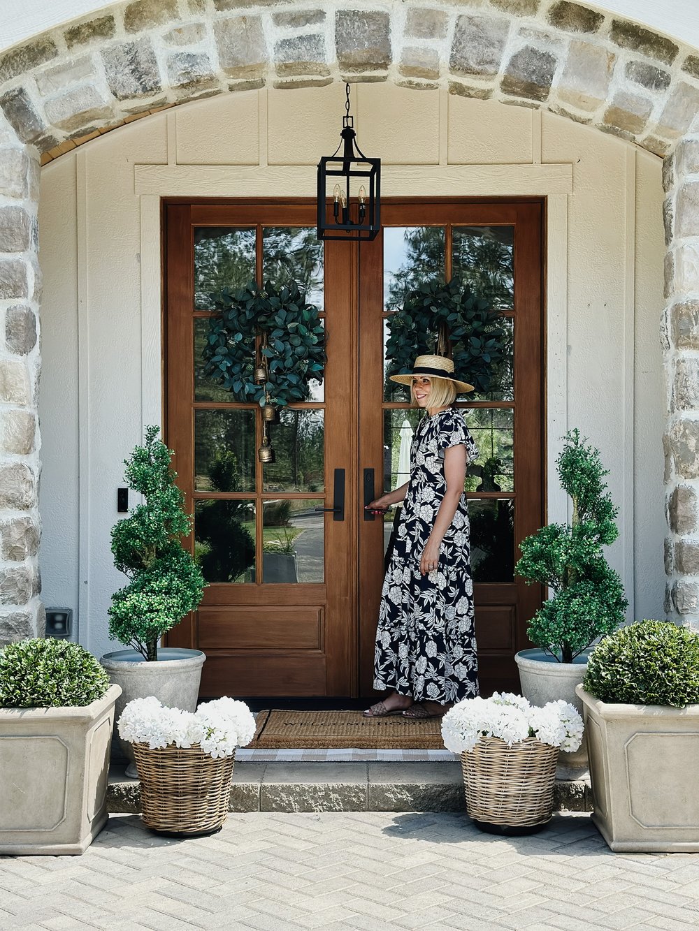 woman standing on porch