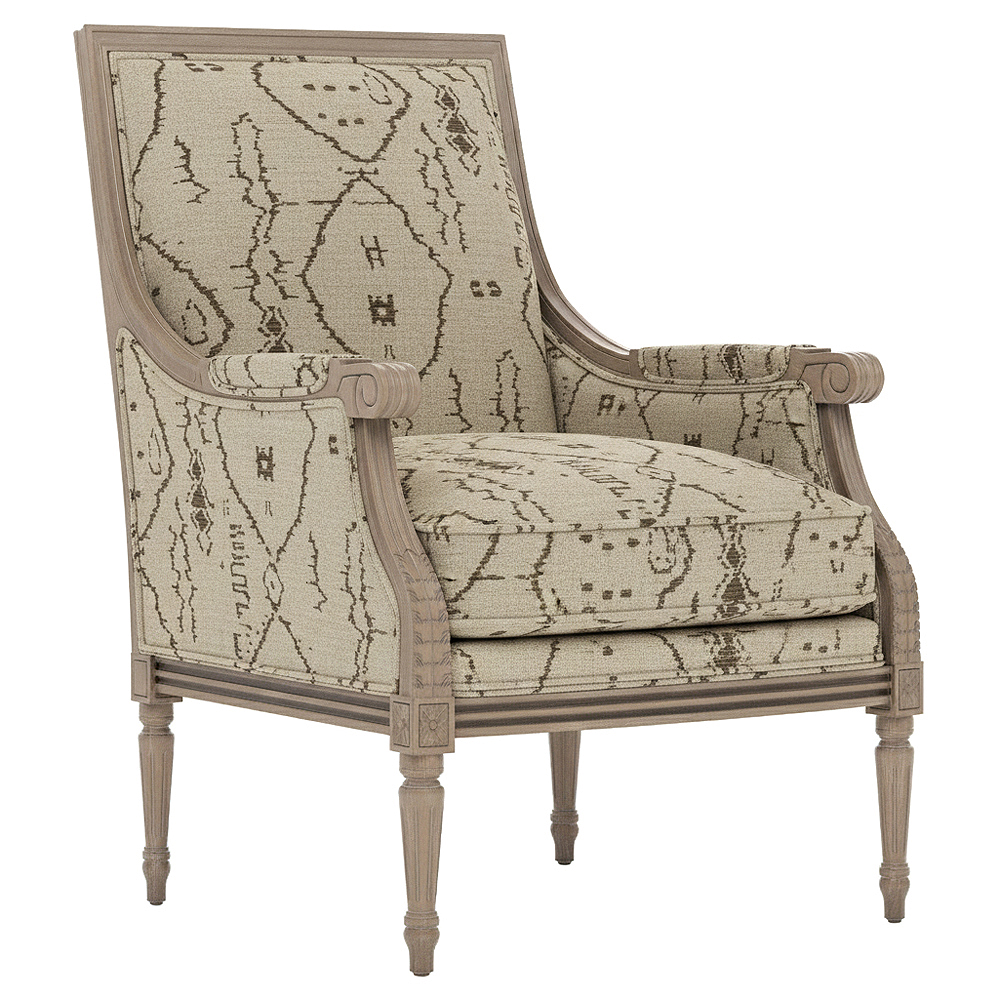 bergere chair with neutral geometric fabric and a brown wooden frame