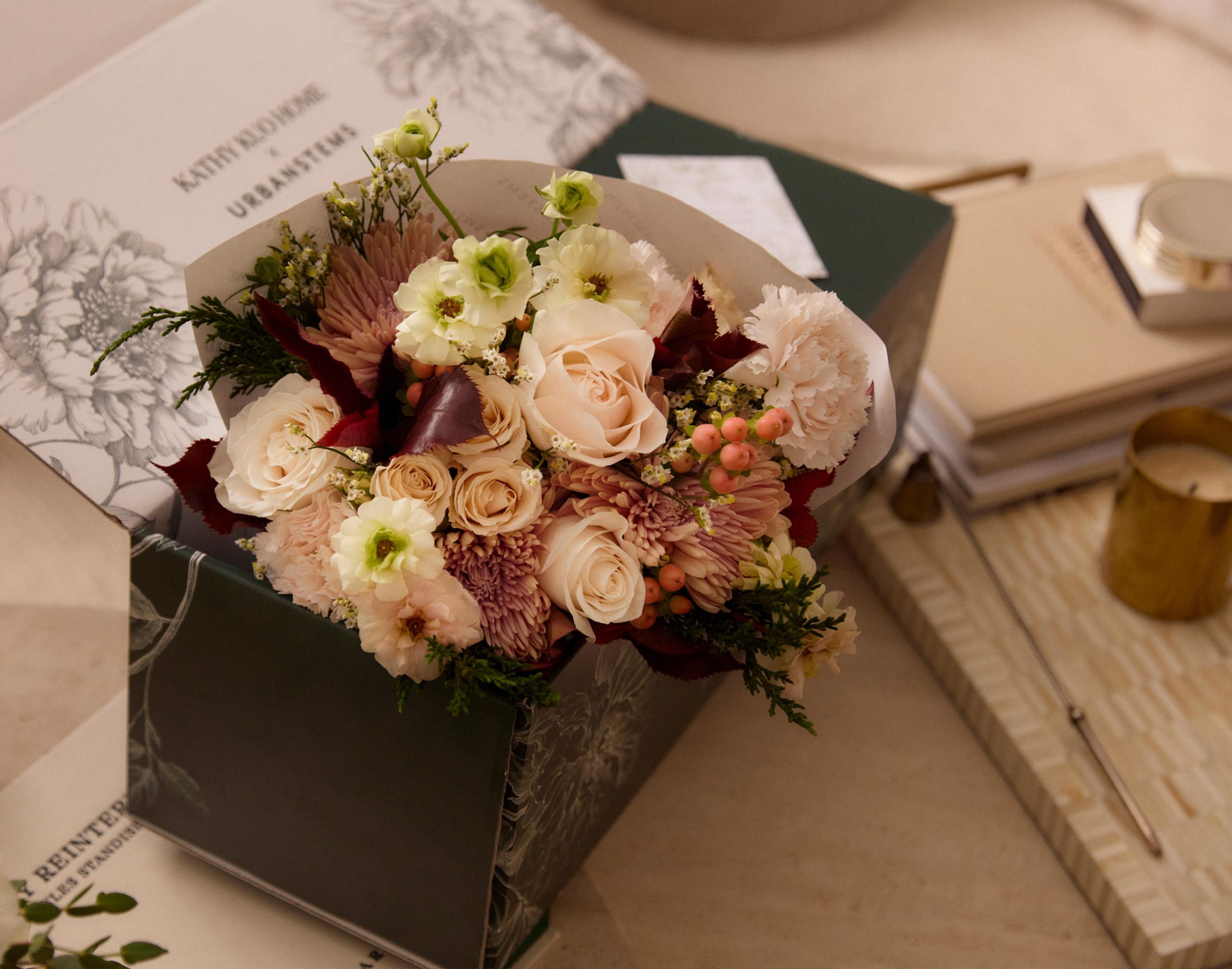 Kathy Kuo Home x Urban Stems floral arranagement with spray roses, butterfly ranunculus, and carnations