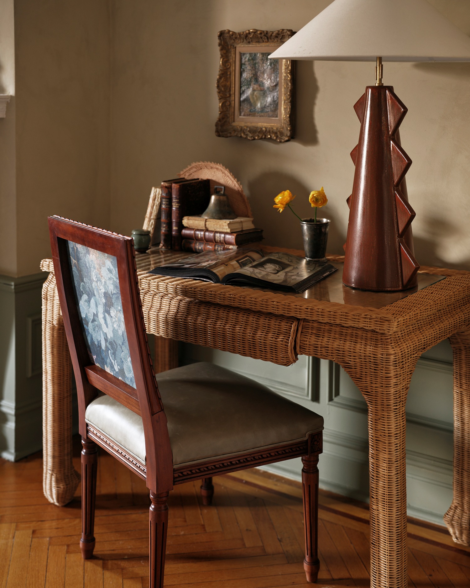 A woven rattan desk in Kathy Kuo's New York living room