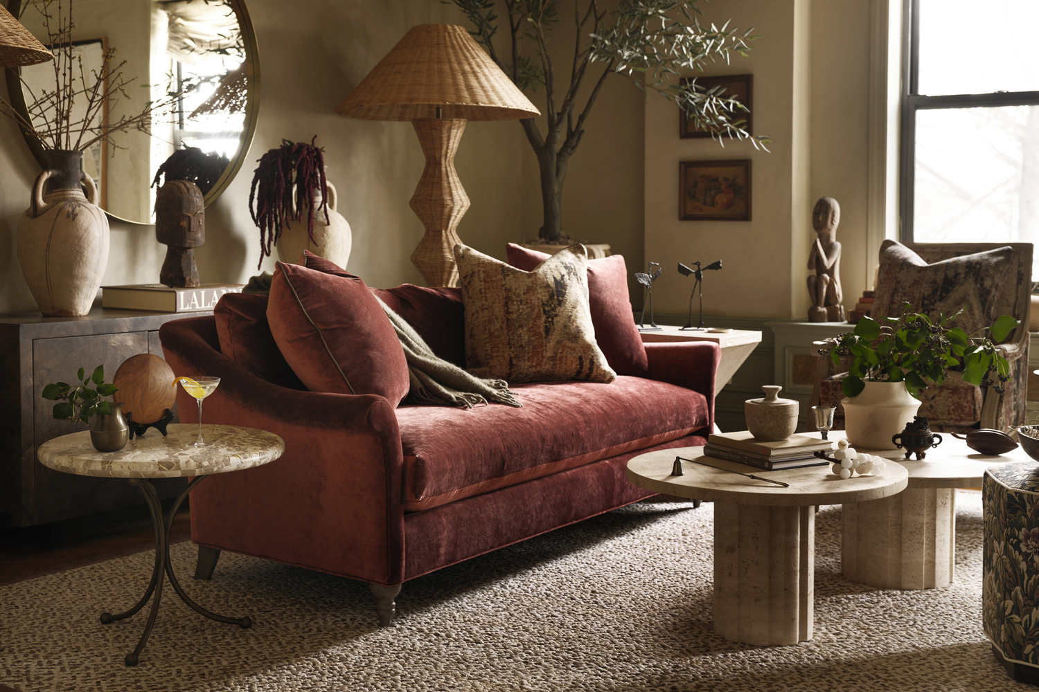 The velvet Amelie sofa sits on top of a Fibreworks rug in Kathy Kuo's New York living room