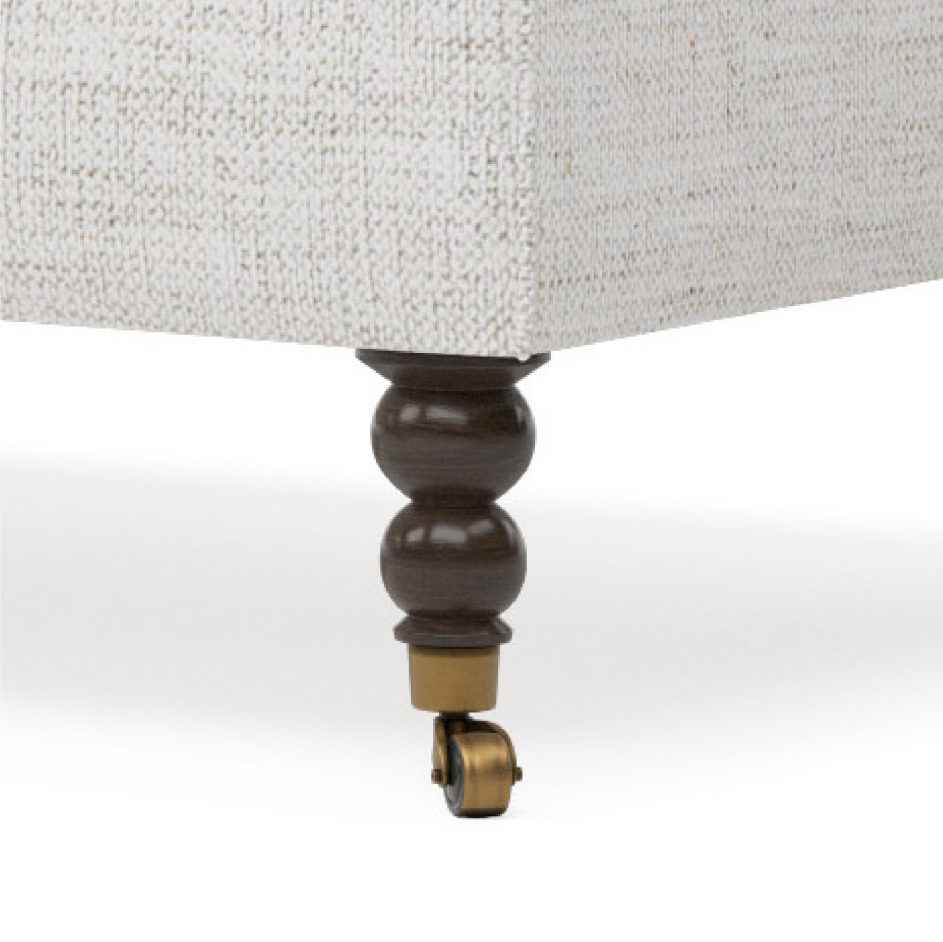 turned wood and caster leg on sofa
