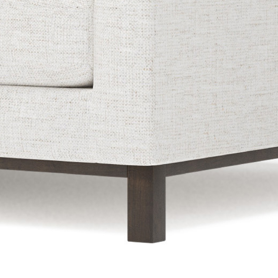 wood rail leg on sofa