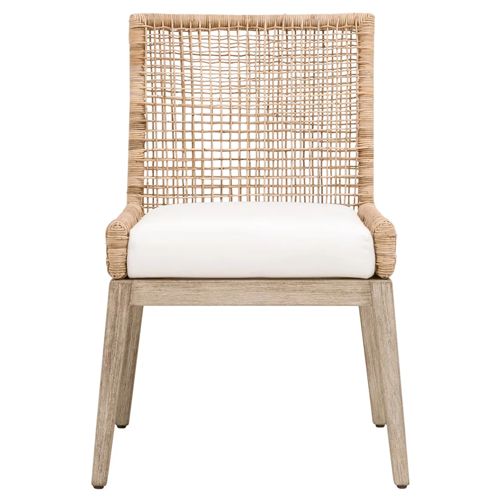 woven rattan dining chair with a white seat cushion