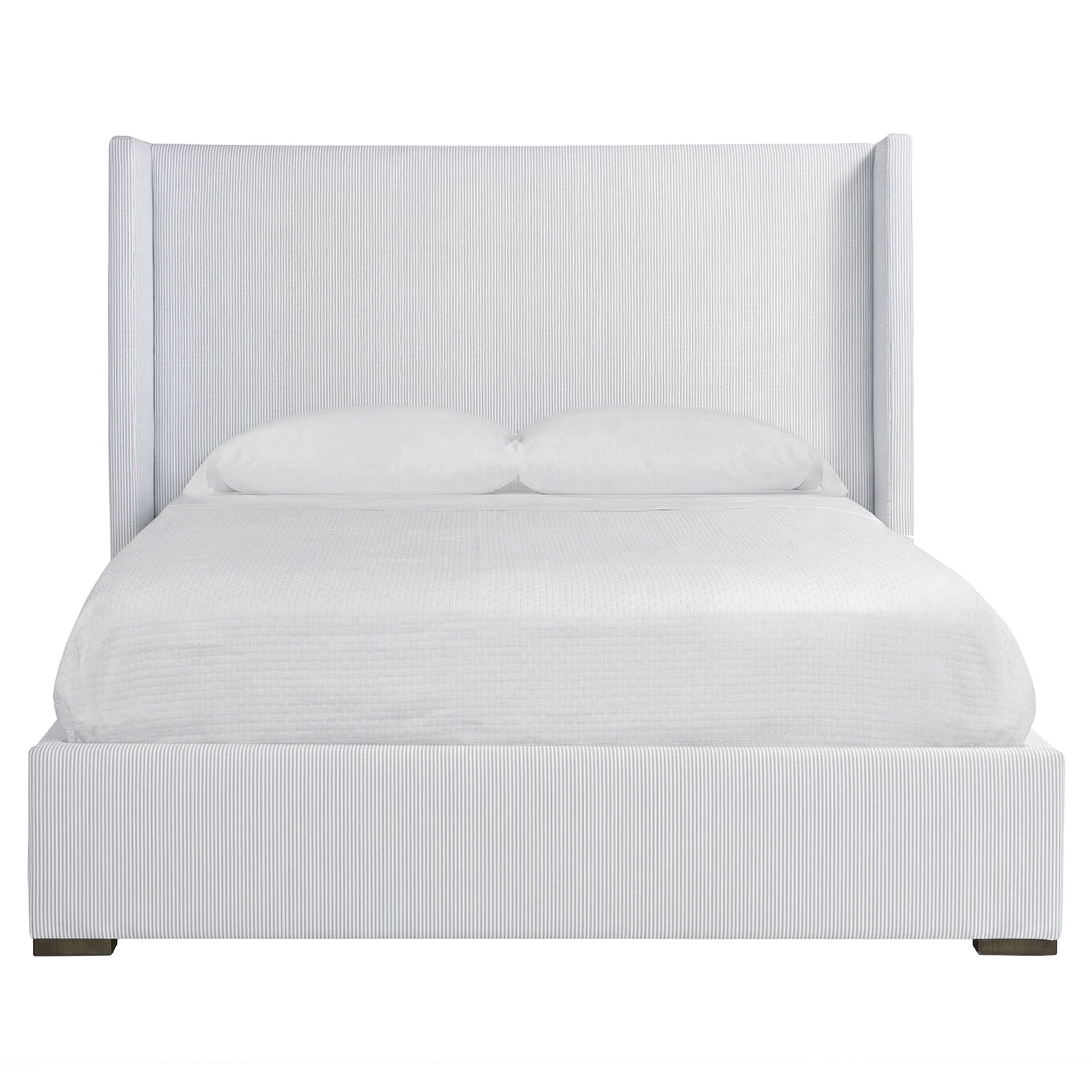 queen bed upholstered in sunbrella performance stripe sea breeze