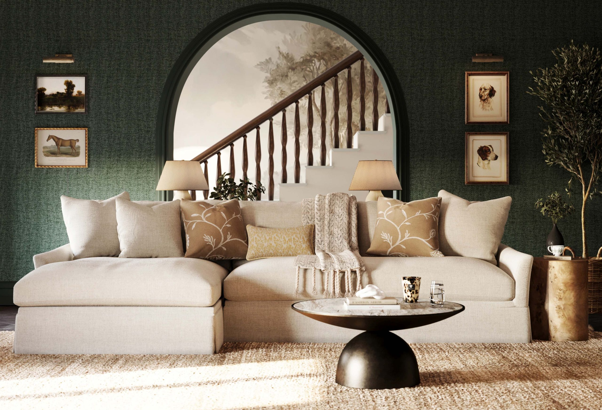 A traditional green drawing room with a jute rug, comfortable chaise sectional, and a round marble coffee table