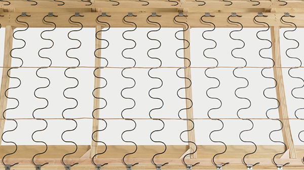 Sinuous springs construction inside an upholstered sofa