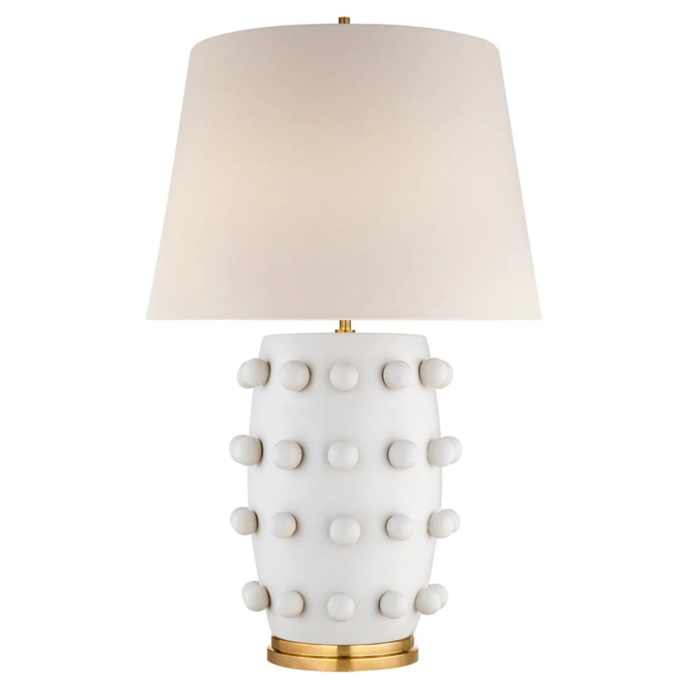 white table lamp with polka dot base and white linen shade
