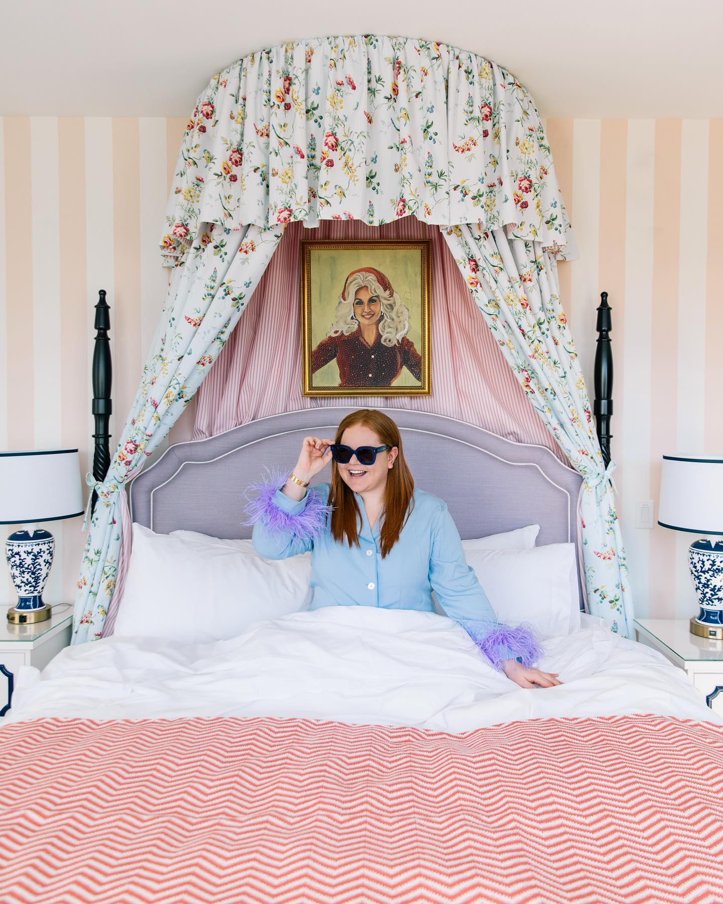 woman in canopy bed