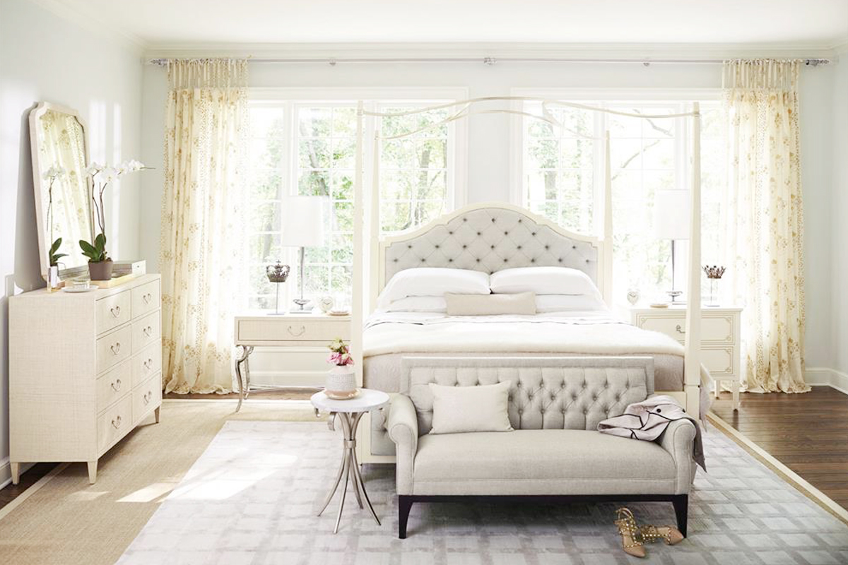 bedroom with white canopy bed