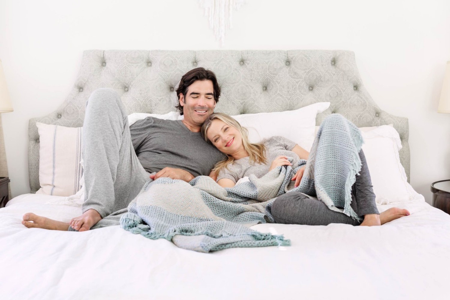 couple on bed lounging