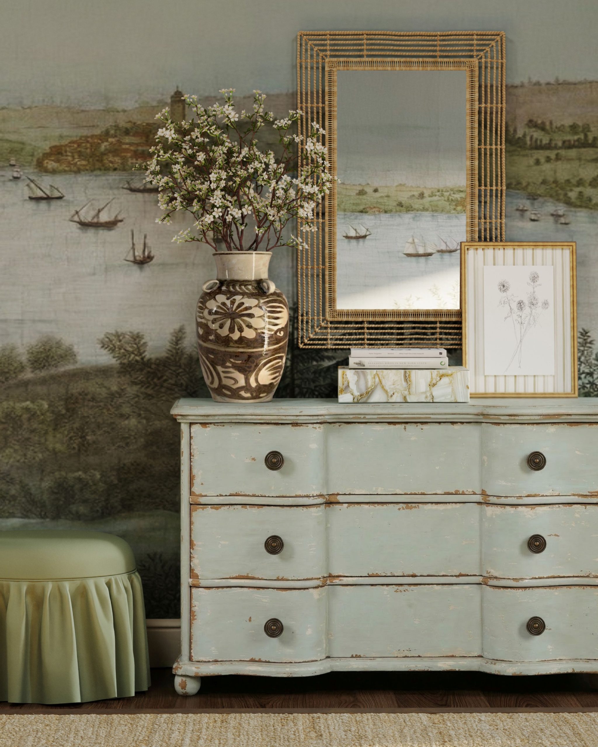 distressed sage green dresser in a bedroom with mural wallpaper