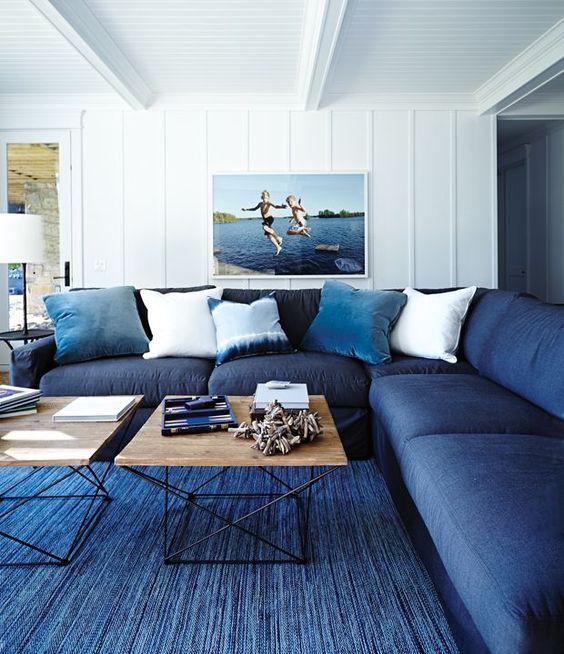 living room with blue rug and couch