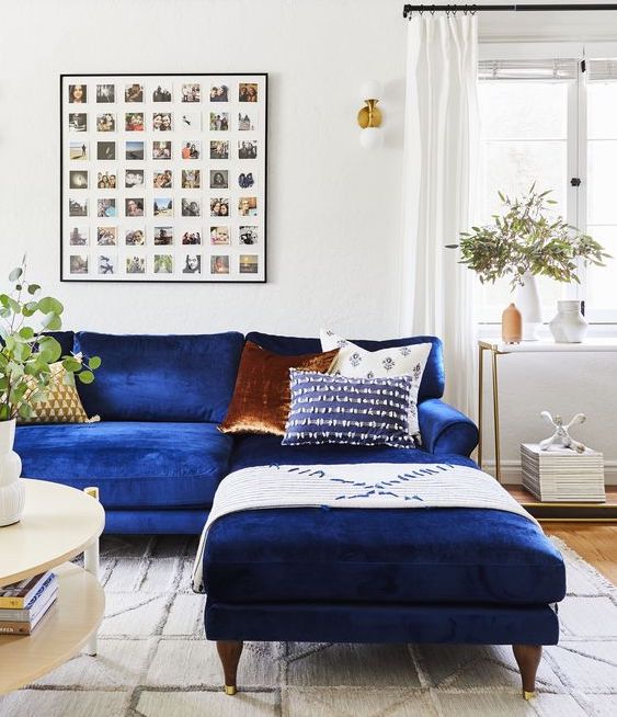 living room with blue velvet couch