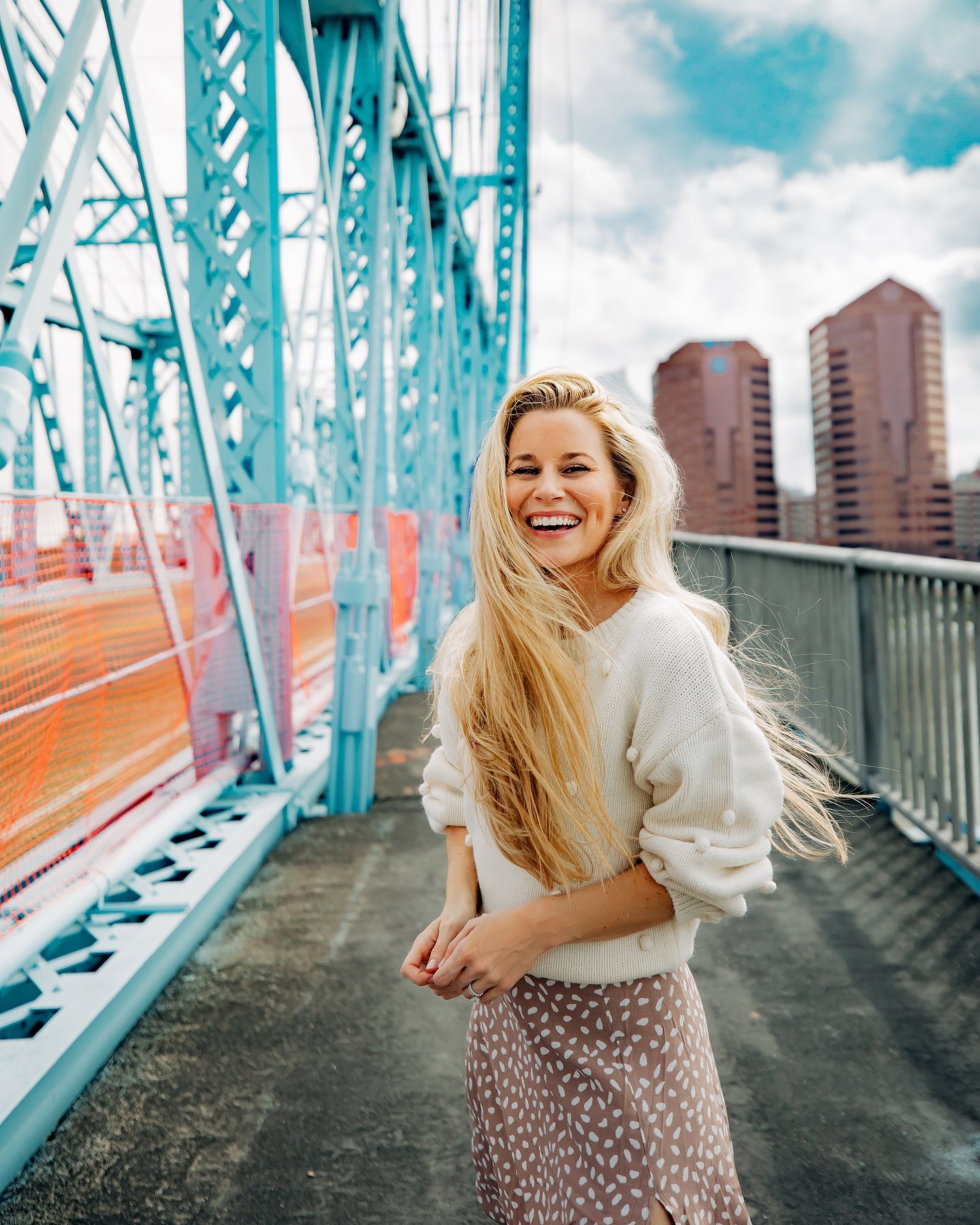 woman standing on bridge
