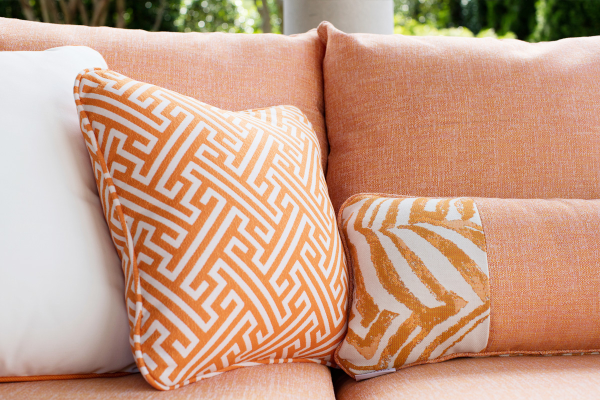 orange outdoor sofa and pillows