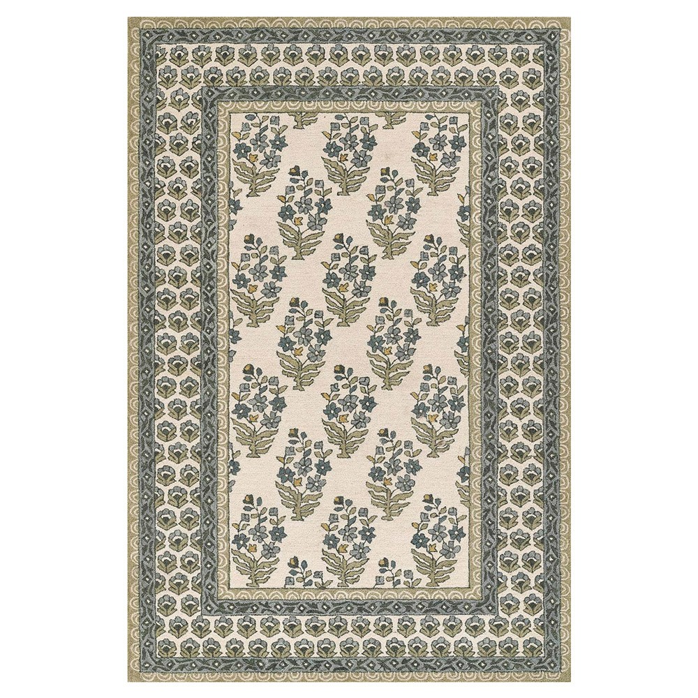 floral patterned green, blue, and cream rug