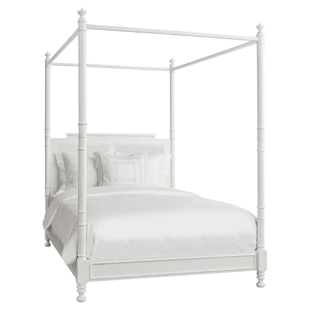 white four-poster canopy bed