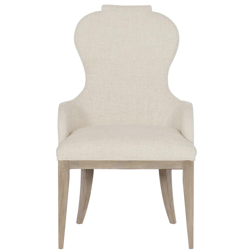 beige upholstered dining chair with brown wood legs