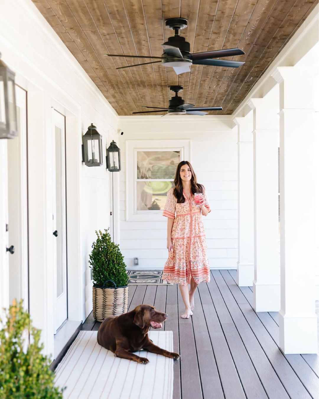 woman and dog on porch