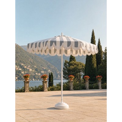 french country patio umbrella Business & Pleasure Co. The designed to provide sleek shade and style The Montague Umbrella - Tassel