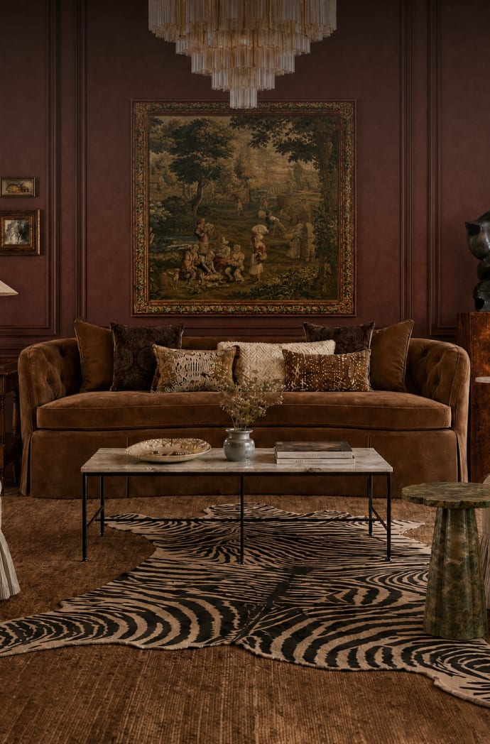 Tuileries living room layered with skirted seating, fringe, and pleated details