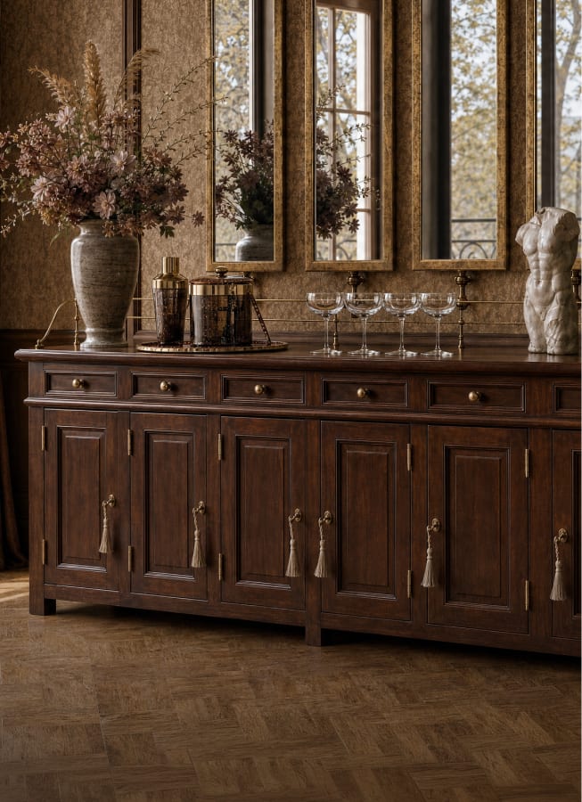 Dark wood sideboard styled beneath a triptych mirror