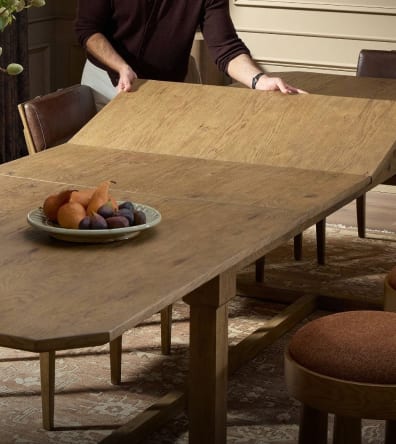 Extendable dining table being prepared for guests