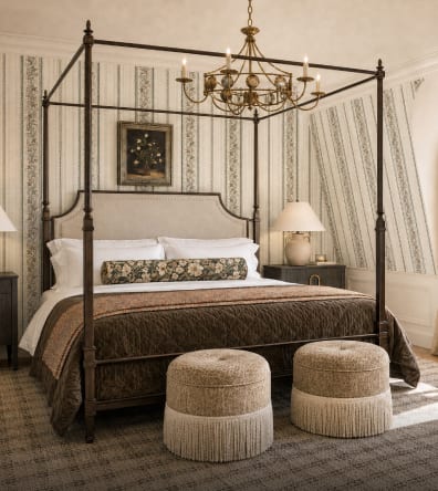 Layered guest bedroom with a canopy bed