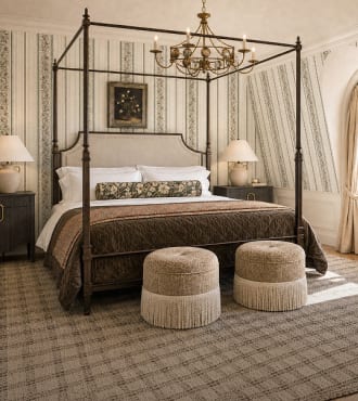 Layered guest bedroom with a canopy bed