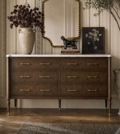 Dark wood dresser styled beneath a mirror