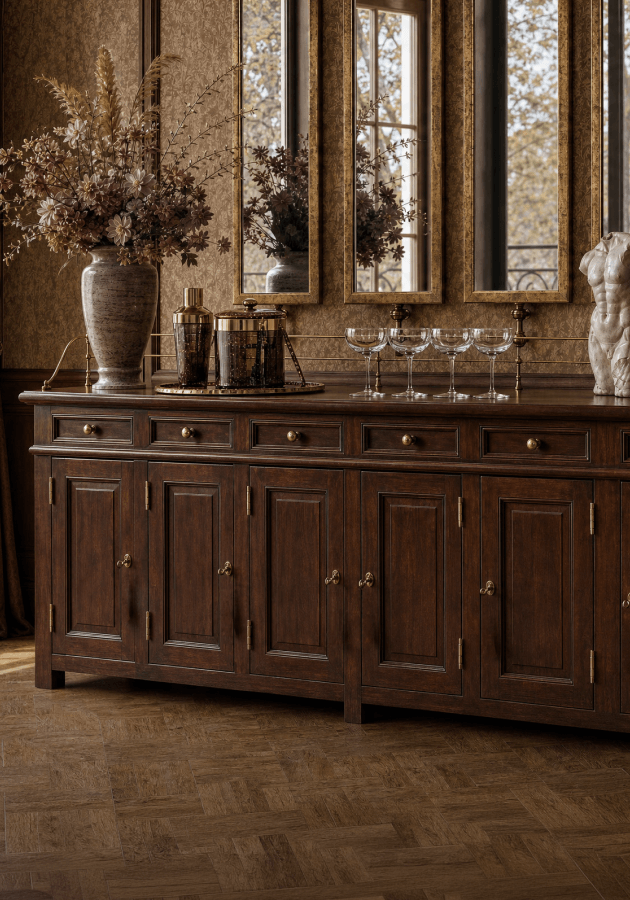 Dark wood sideboard styled with barware beneath mirrors